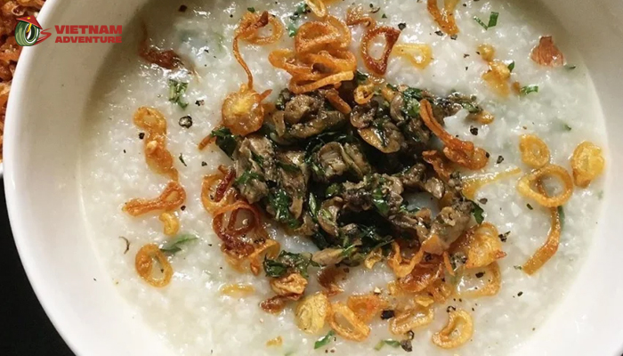 Bowl of mussel porridge with lots of mussel meat