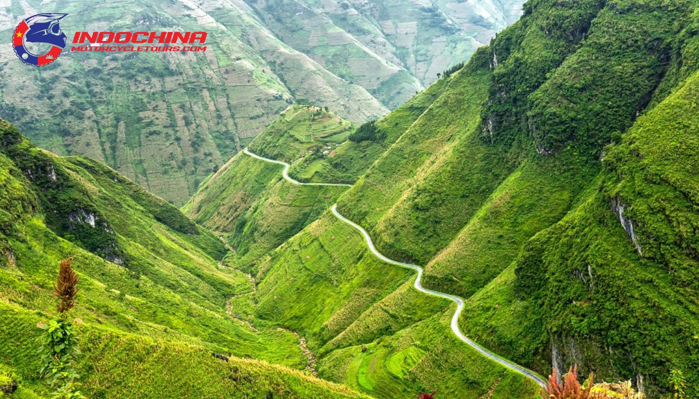 Motorbike riders navigating the winding roads of the scenic Ma Pi Leng Pass