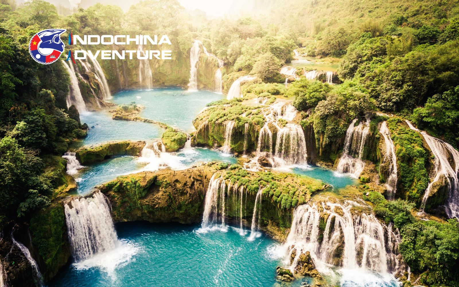 Ban Gioc Waterfall Vietnam cascading over limestone cliffs into jade-green pools in Cao Bang