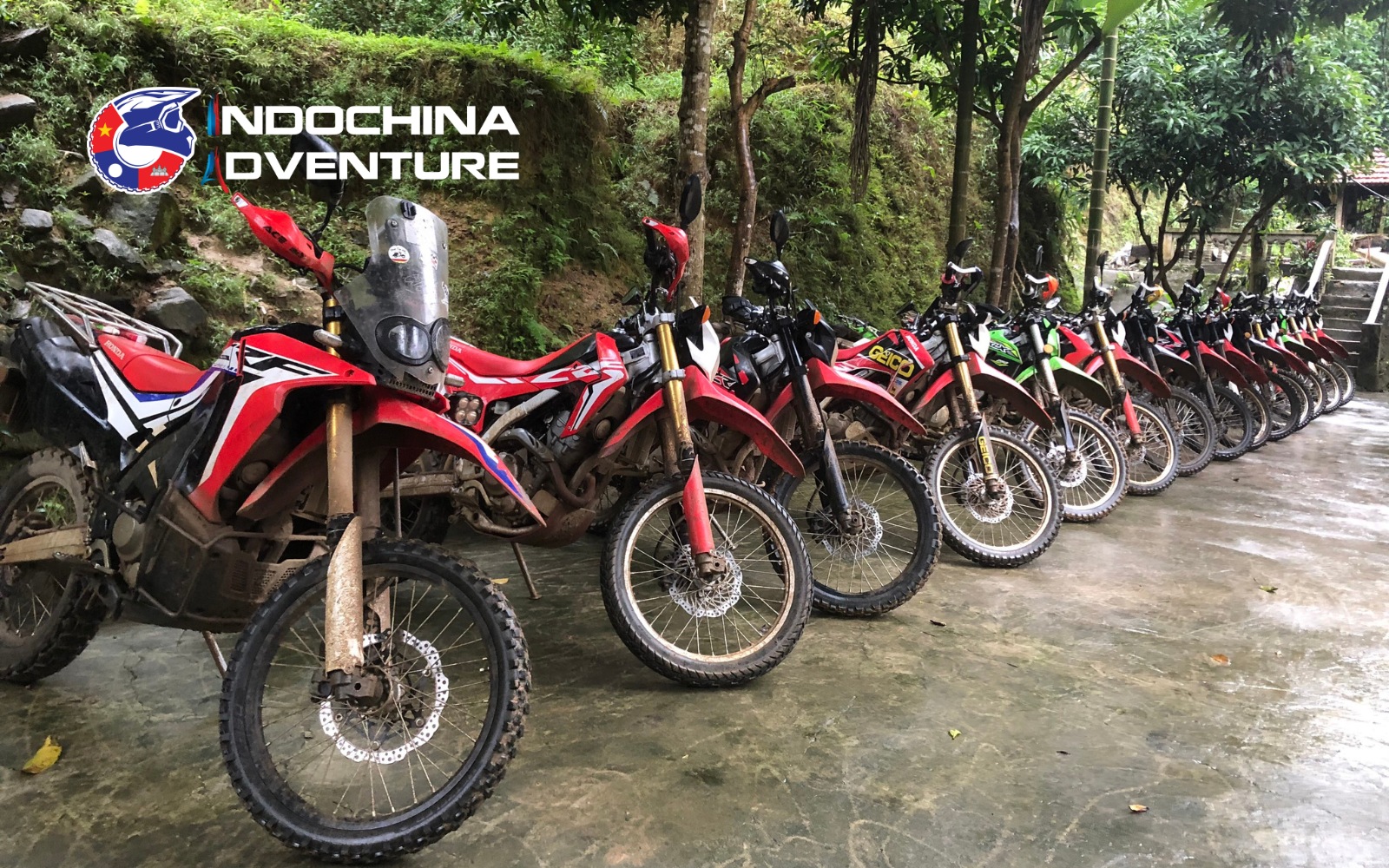 Honda dirt bike leading on a rugged trail