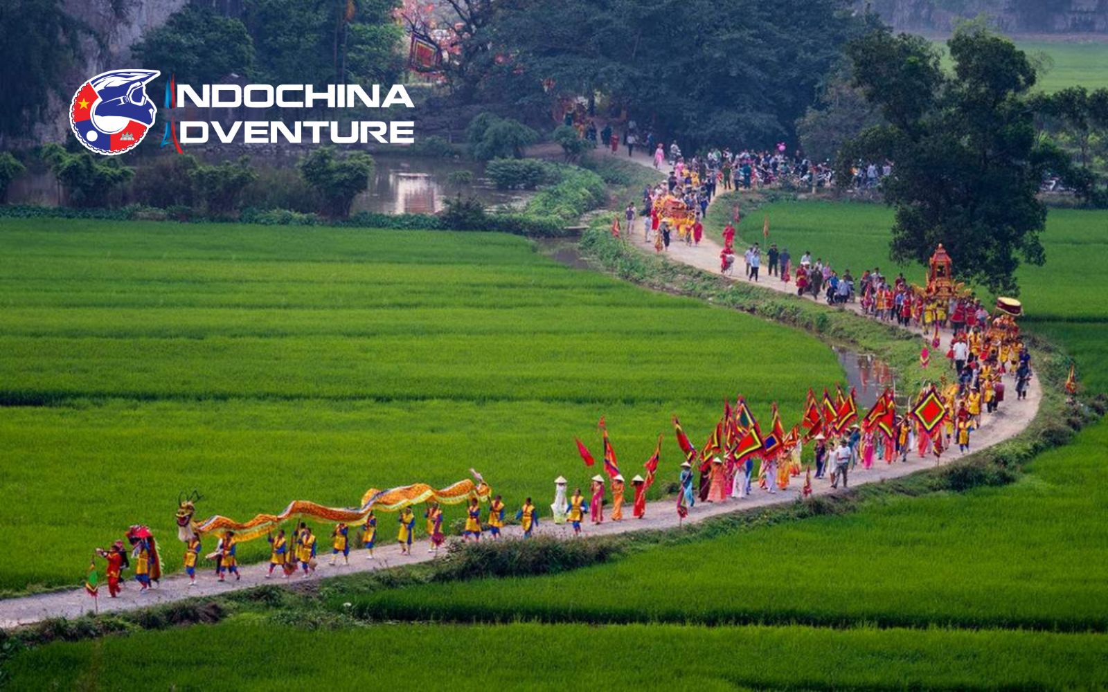 Ba La palanquin procession through the tree-lined road during the La Temple Festival