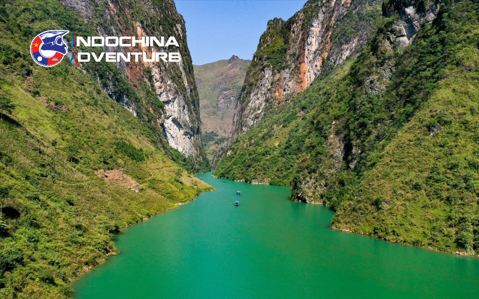 Exploring the mountainside trail on a motorbike, which runs parallel to the river below, offers a charming water landscape