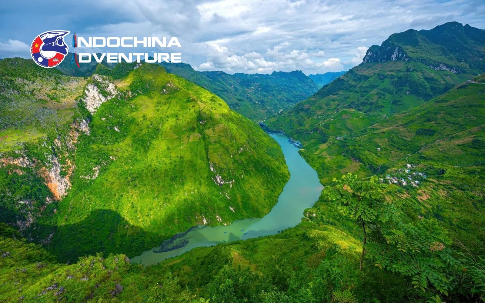 The expansive views display terraced fields, winding rivers, and jagged mountains unobstructed