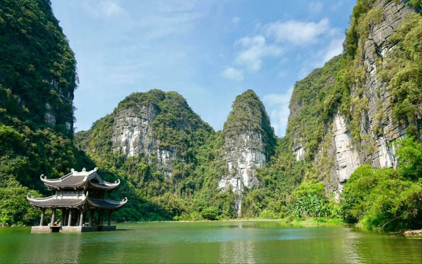 Glide past caves and temples in a UNESCO-recognized river landscape