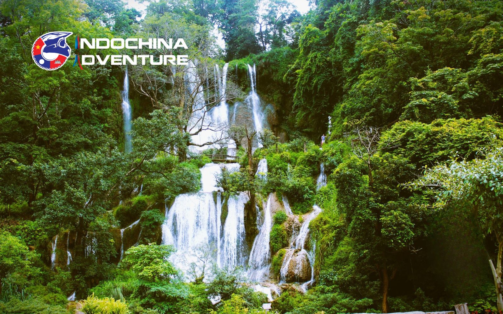 Dai Yem waterfall on a Son La motorbike tour, providing a refreshing dip in forest surroundings.