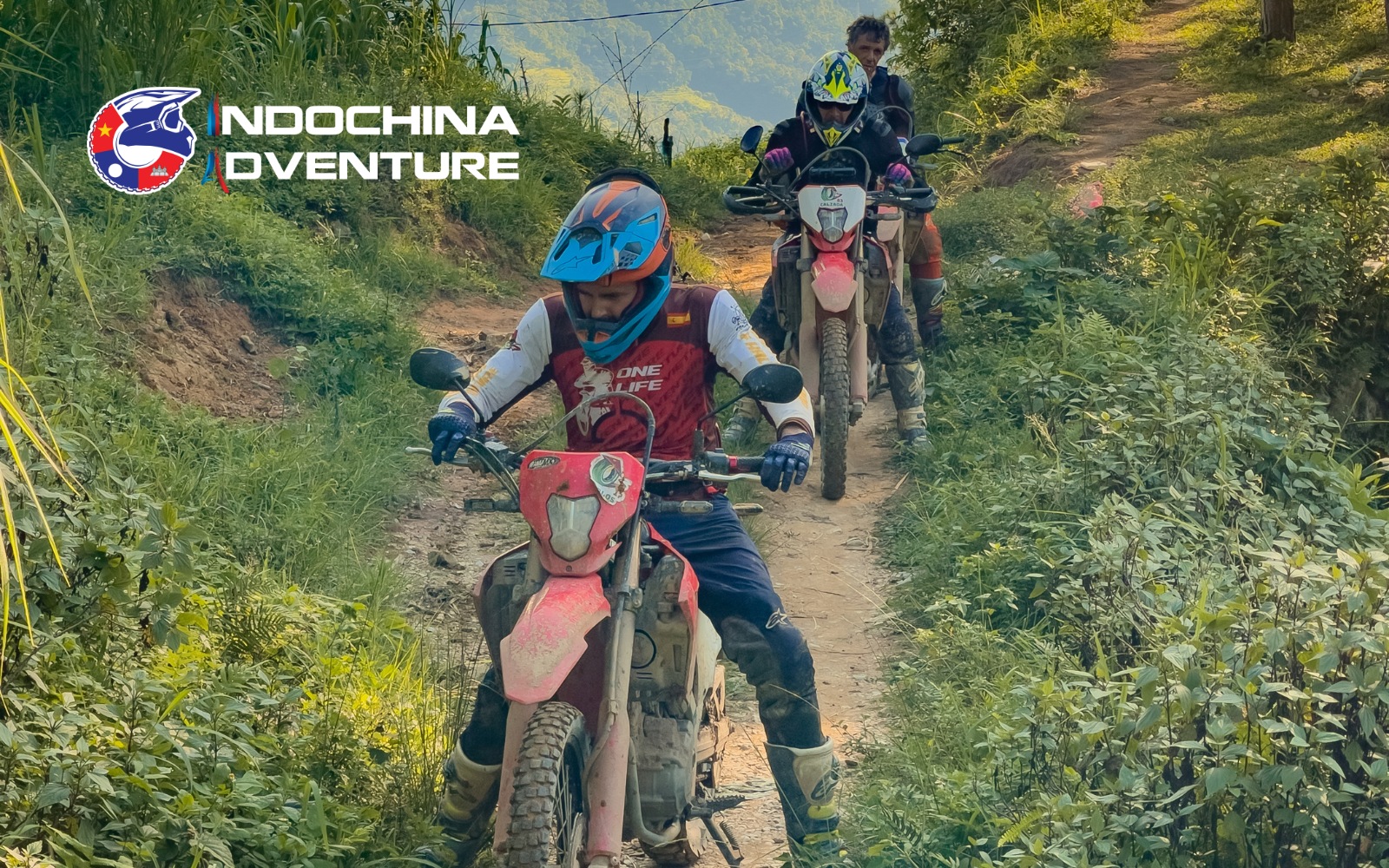 Adventurers riding through scenic valleys on a Ha Giang motorbike tour
