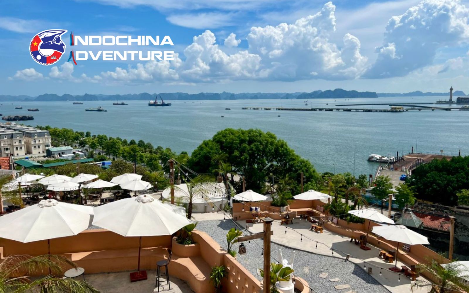 Coastal café terrace with sweeping bay views