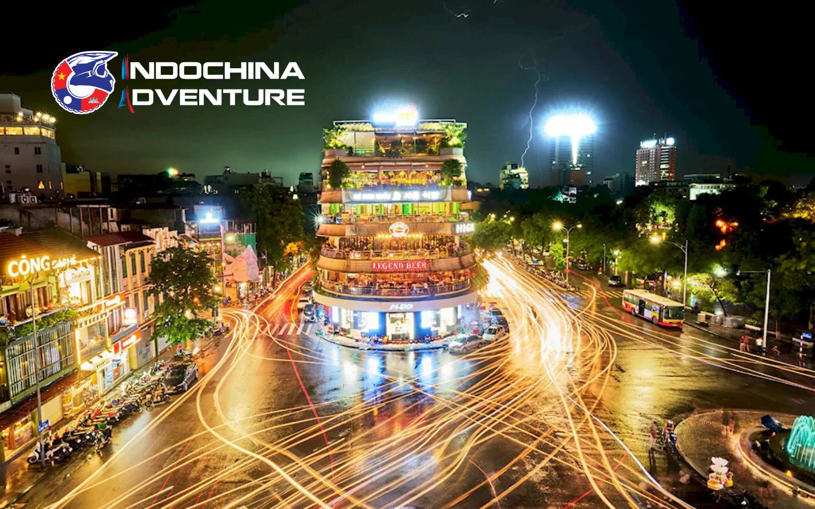 Zipping through Hanoi's Old Quarter on a motorbike tour, vibrant markets and lanterns aglow