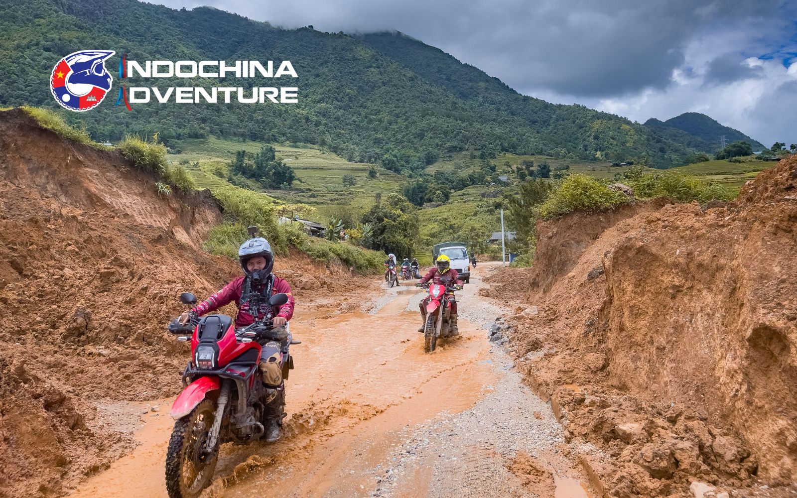 Motorcyclist riding O Quy Ho Pass, Sapa’s iconic mountain road, through misty peaks.