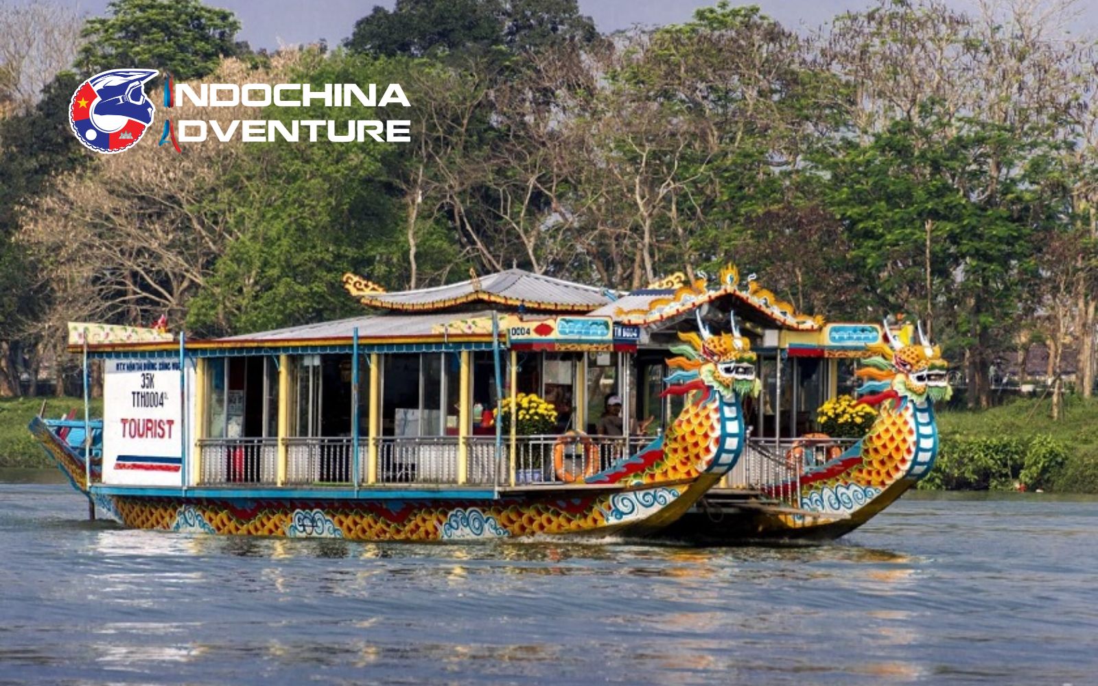 A calm river cruise offering scenic views in Hue in the rain Covered dragon boat moving along the Perfume River in Hue rainy season