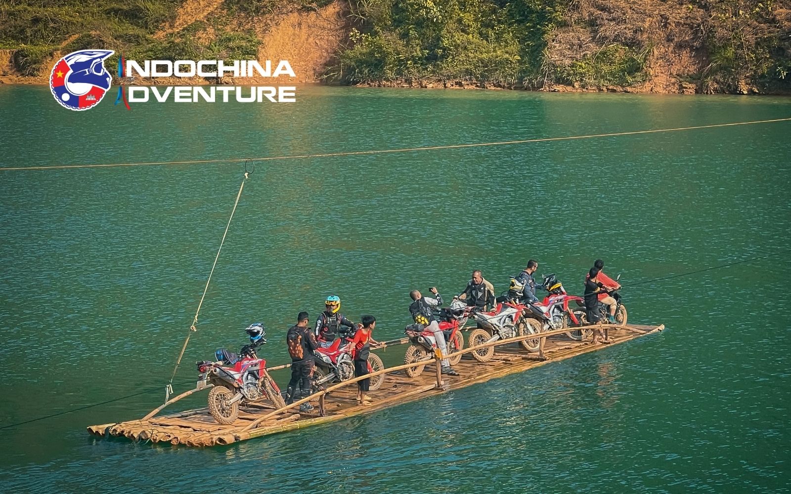 Cruising the turquoise waters of Nho Que beneath the towering mountain canyons