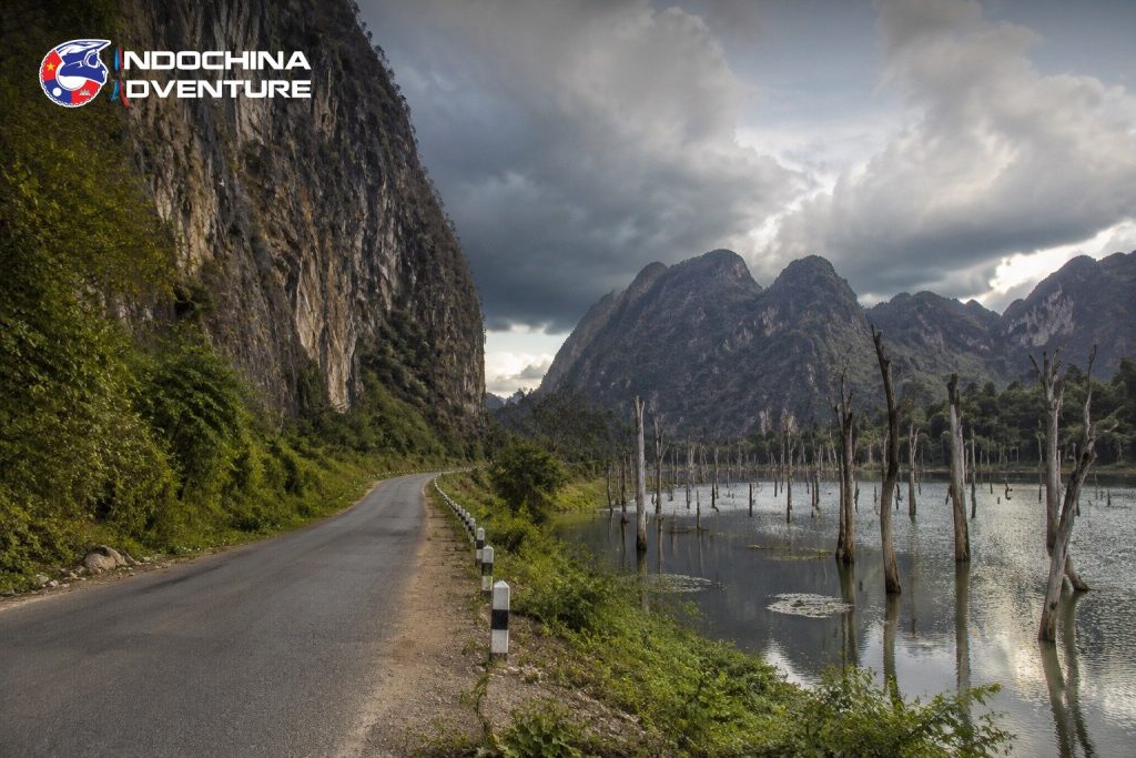 Road cutting between limestone karst mountains on the Thakhek Loop in central Laos